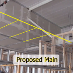 Constructing a vertical soffit from a drywall suspension grid system